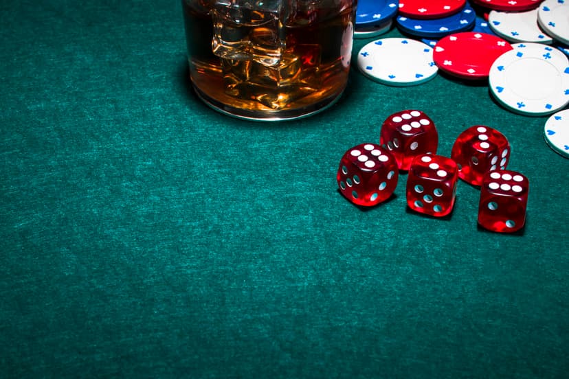 whisky-glass-with-ice-cubes-gambling-table.jpg